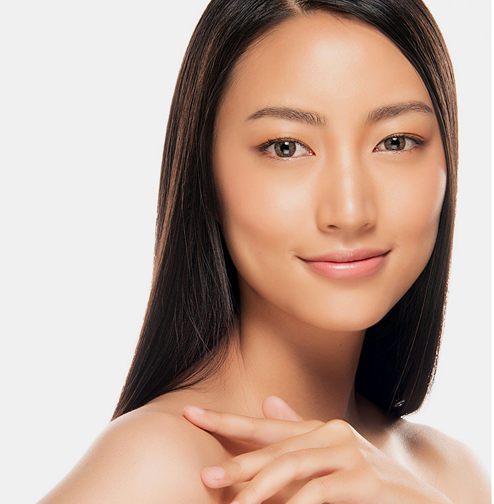 Woman with smooth skin and straight hair on a light background